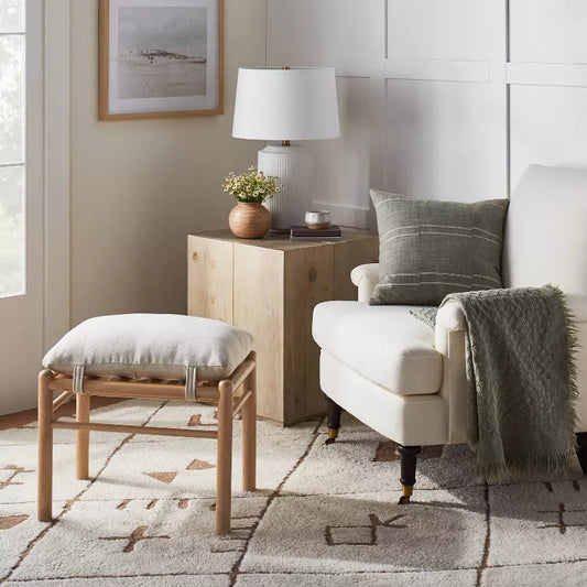 Emery Wood and Upholstered Ottoman with Straps